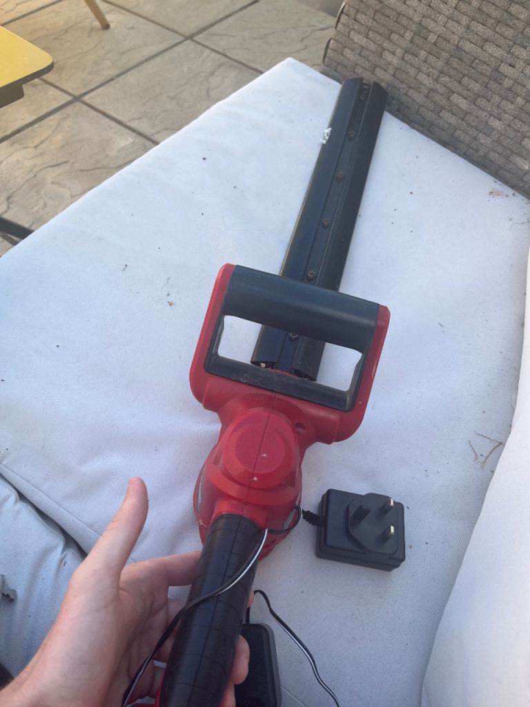 Cordless Hedge Trimmer with Charger – Red & Black, Good Condition