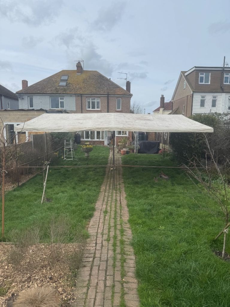 Market stall with white canopy. 20 feet x 20 feet and 8 feet 6 inches at the highest point. 