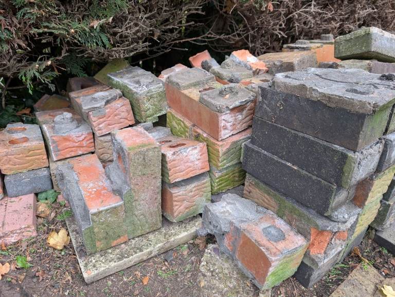 Old bricks with cement (demolished brick bbq)