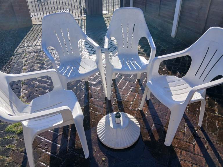 Garden chairs table and umbrella stand