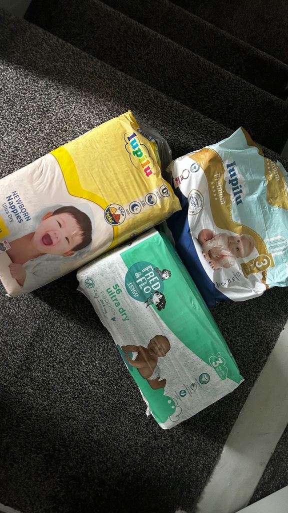 2 brand nappies 1 opened bag 