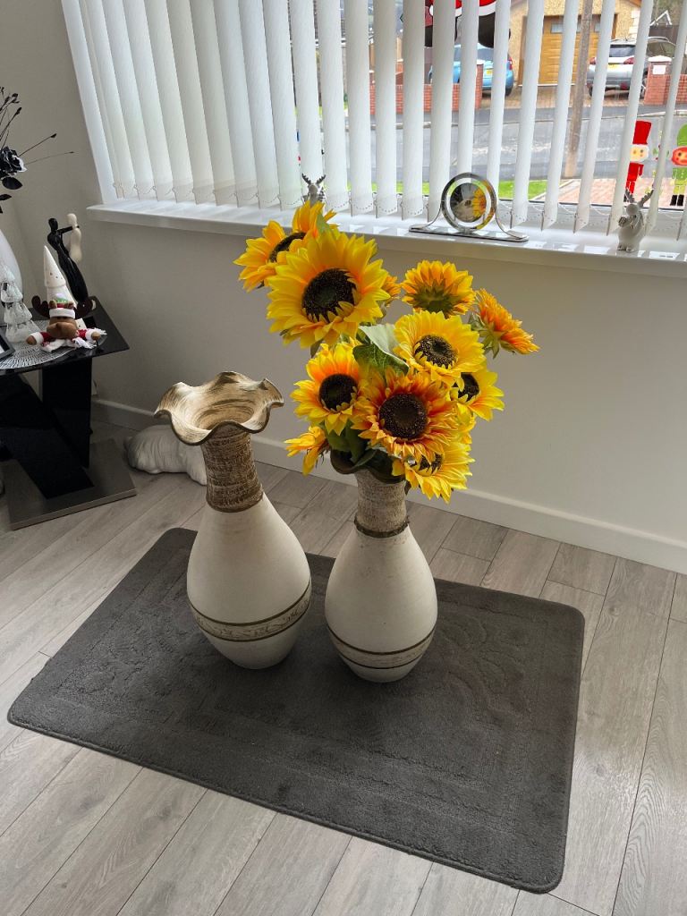 Artificial sunflowers and vase 
