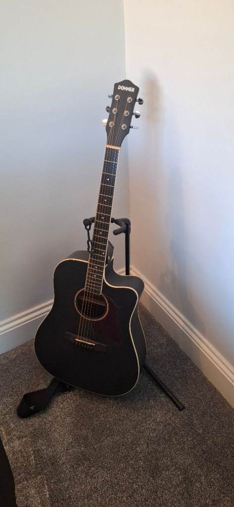 Acoustic Guitar with Stand – Good Condition plus small acoustic guitar. Plus carry bag.