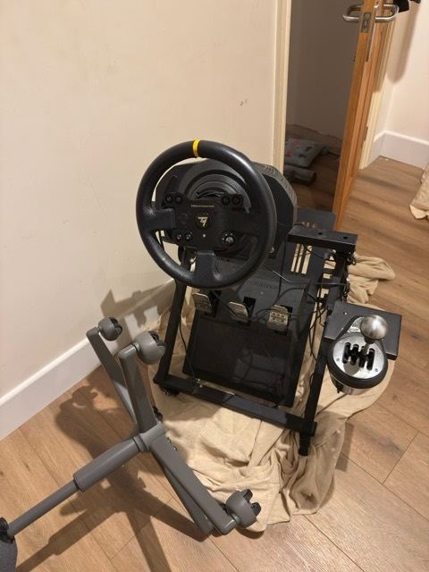 Thrustmaster wheel, pedals, gearbox and stand.