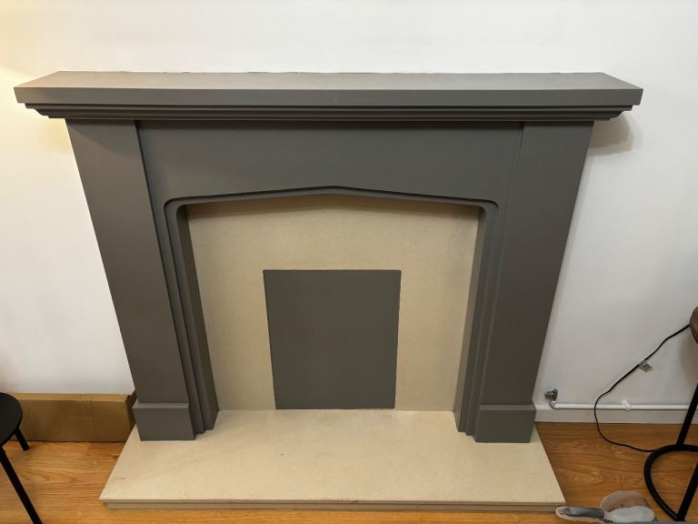 Grey painted wooden mantle piece with stone base and insert, good condition.