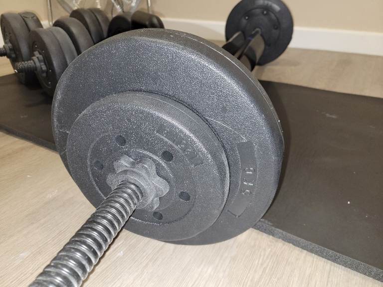 Barbell and dumbell sets with weights and a kettle bell kettlebell