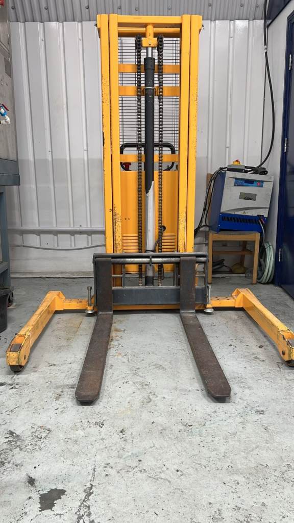 Pallet Stacker, yellow industrial semi-electric straddle pallet stacker