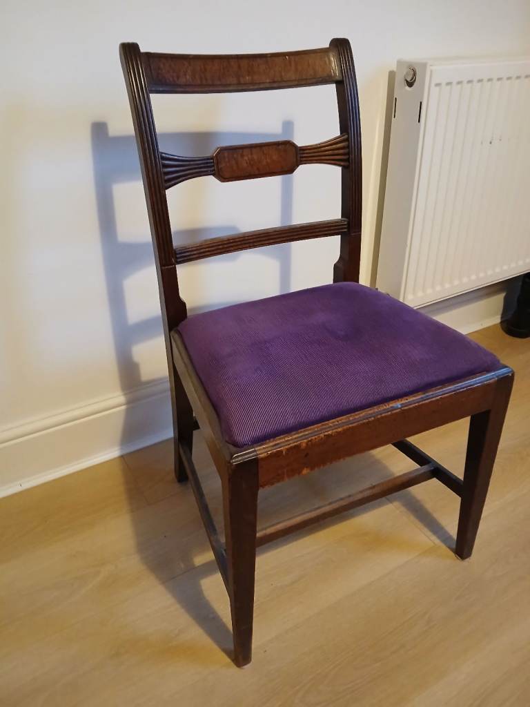 Dark brown chair with purple seat cover