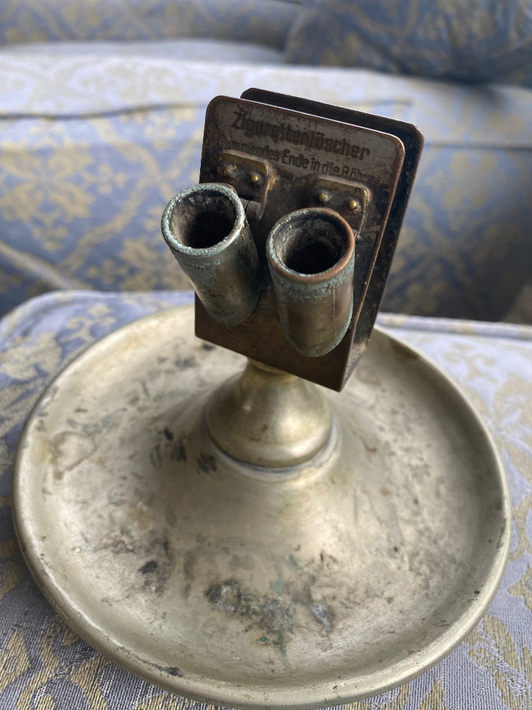Cigarette ashtray and holder