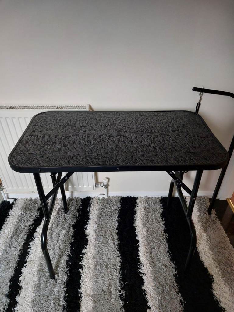 Black foldable pet grooming table with adjustable arm