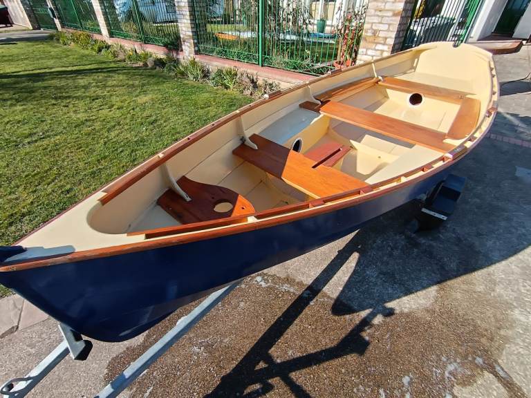 Clinker "Western Skiff" rowing/sailing dinghy, with trailer, cover, oars and electric outboard