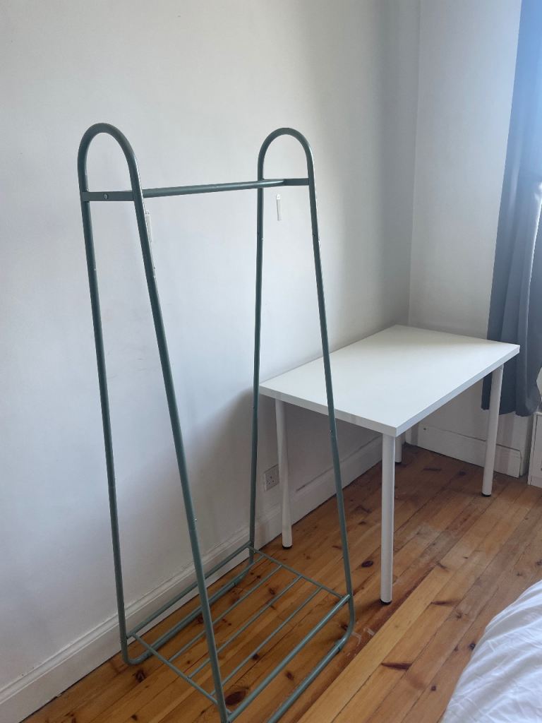 Green clothes rail