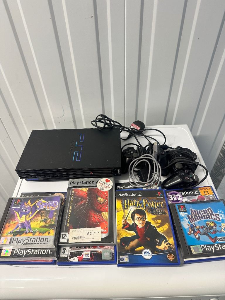Play station  2   Console  X 2 controllers & games 