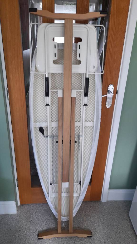  Industrial iron and extra large ironing board and hanging rail.