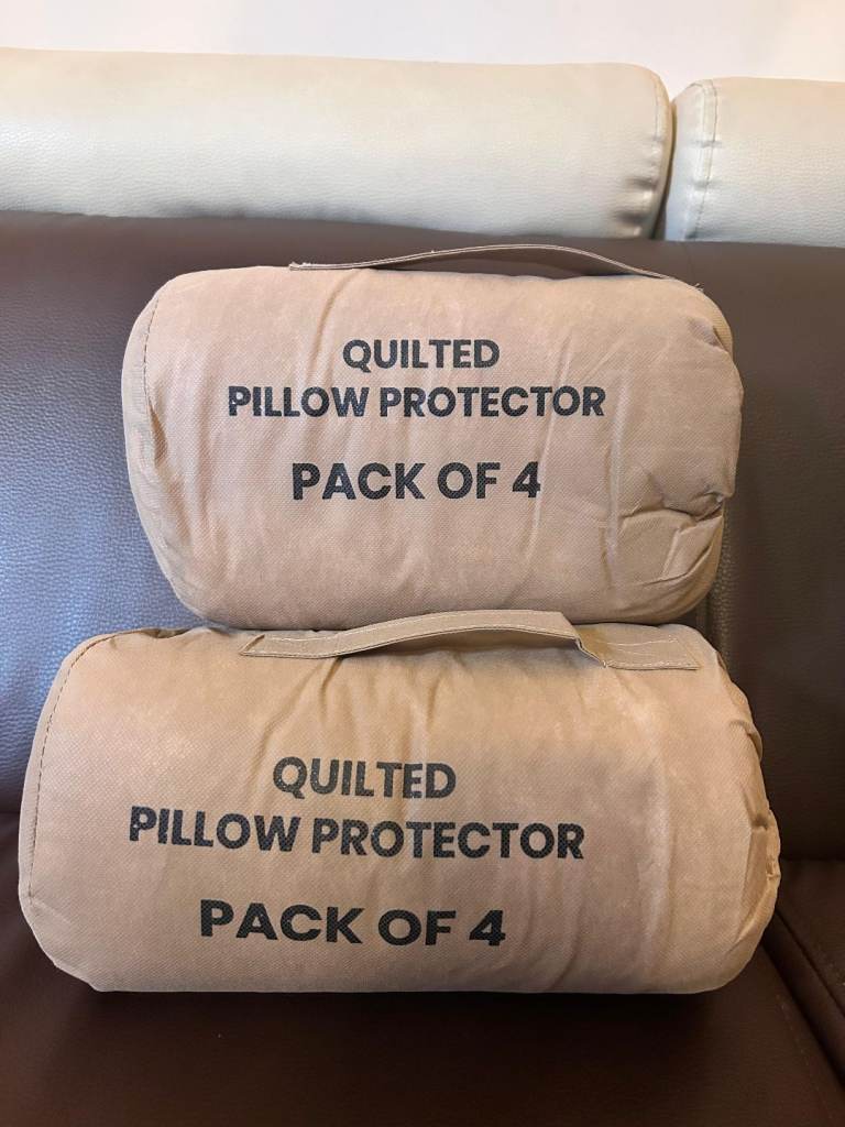 8 Brand New Quilted Zipped White Pillow Protectors. 