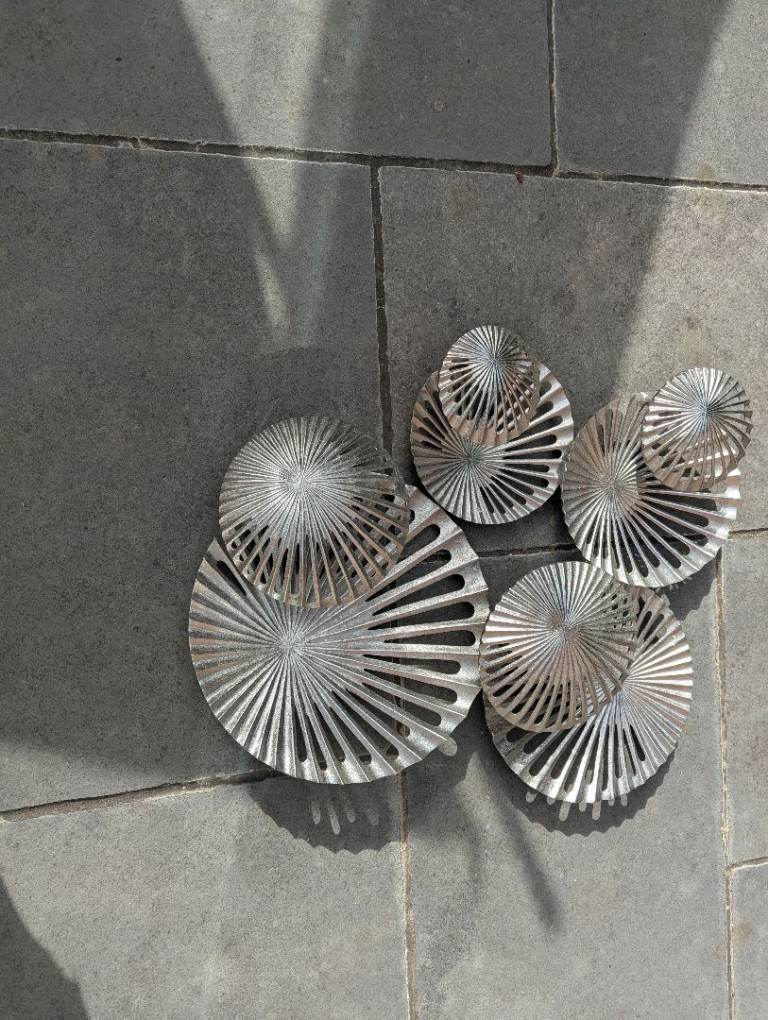 Metal wall art with candle position within