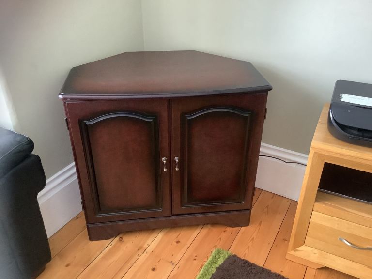 Dark wood corner cupboard