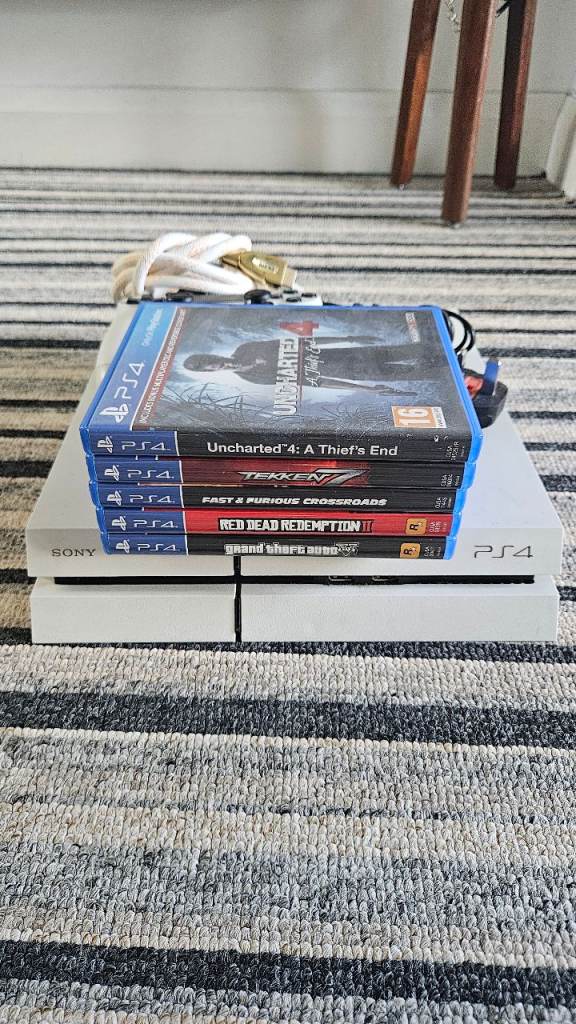 Sony PlayStation 4 Slim Console with 5 PS4 Games – Good Condition