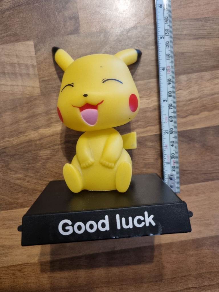Pokemon Pikachu Bobblehead with Mobile phone Holder.