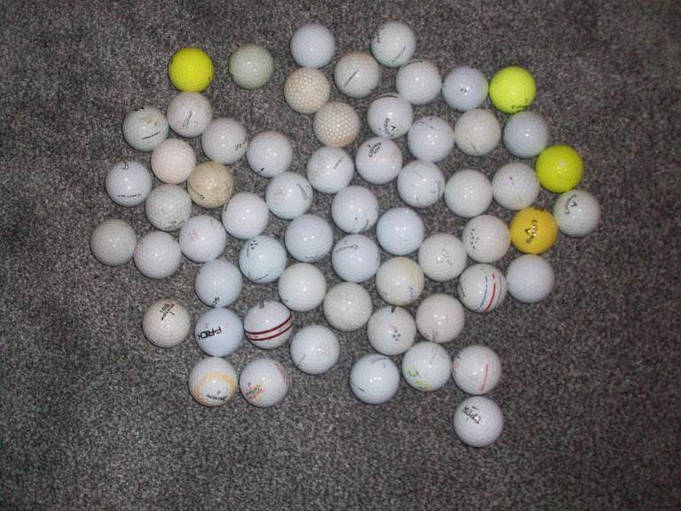 60 well used or discoloured golf balls. Ideal for practice. A bargain at £2 the lot