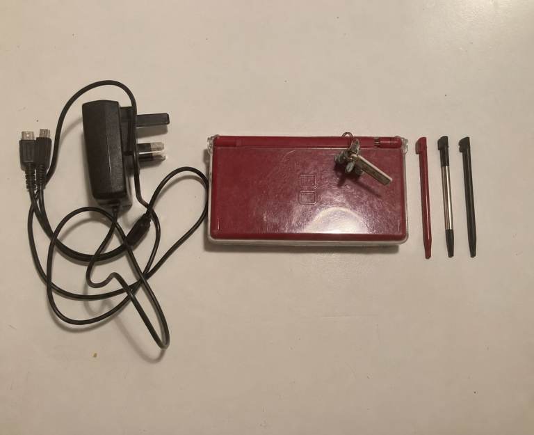 Red Nintendo DS Lite in protective case with Palkia Charm, Charger & Styli
