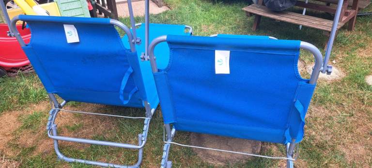 Pair of folding sun loungers chairs for garden with shade 