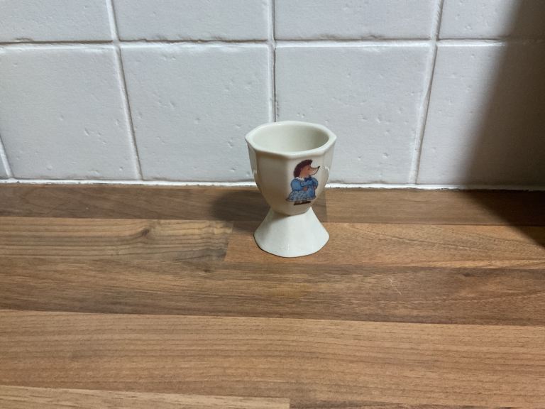 Vintage white egg cup with hedgehog on the front 