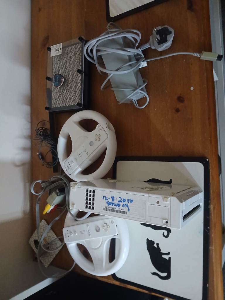 Nintendo Wii Console with Steering Wheels and Accessories