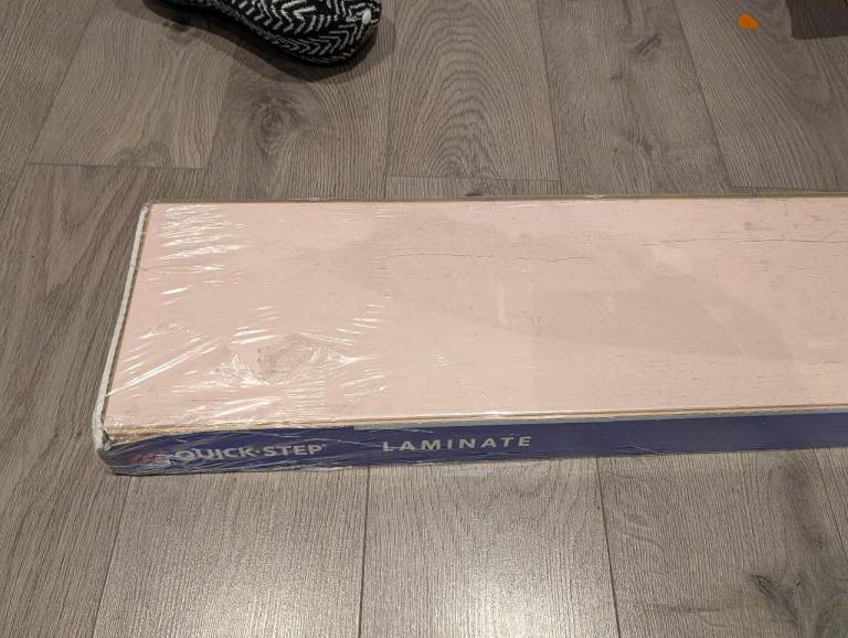 Unopened box of Rose/pink quickstep laminate flooring 