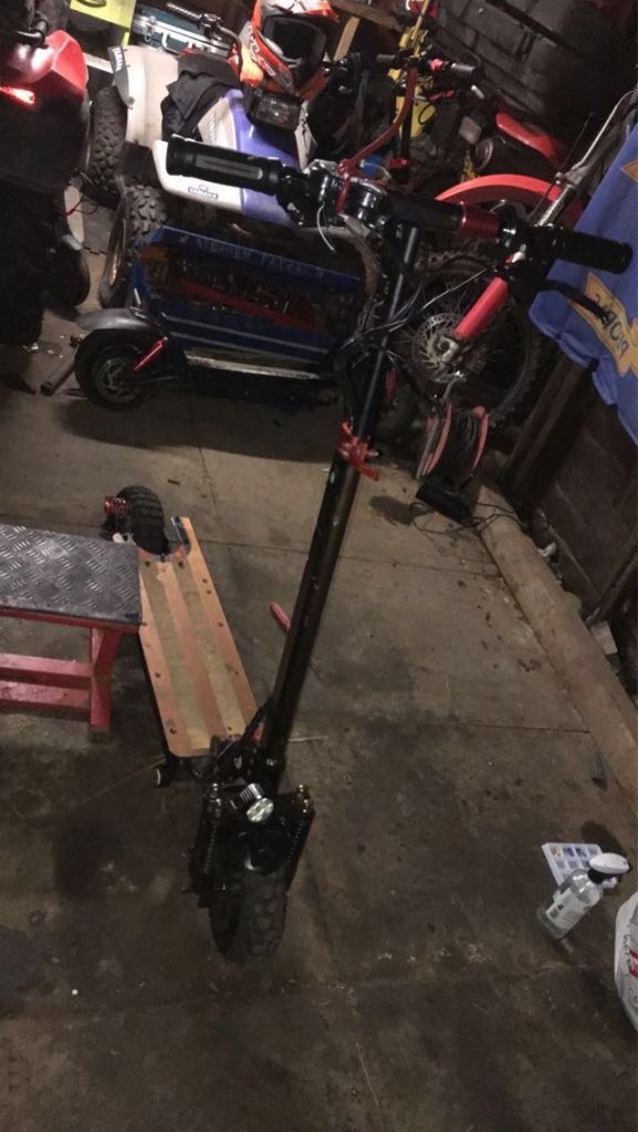 Electric Scooter with Red Accents – Good Condition