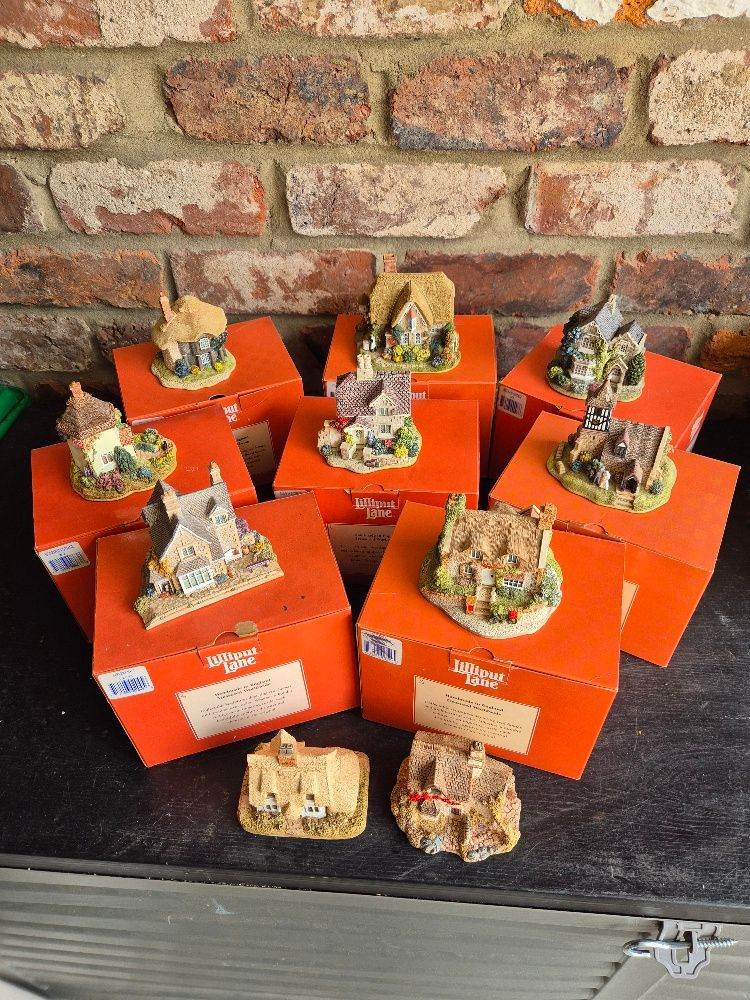 10 lilliput cottages 7 have original boxes, one box atfront is not original 2 have no box