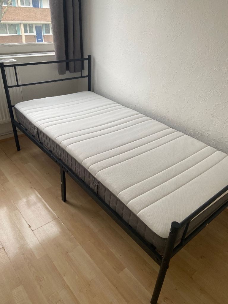 Single metal bed with mattress