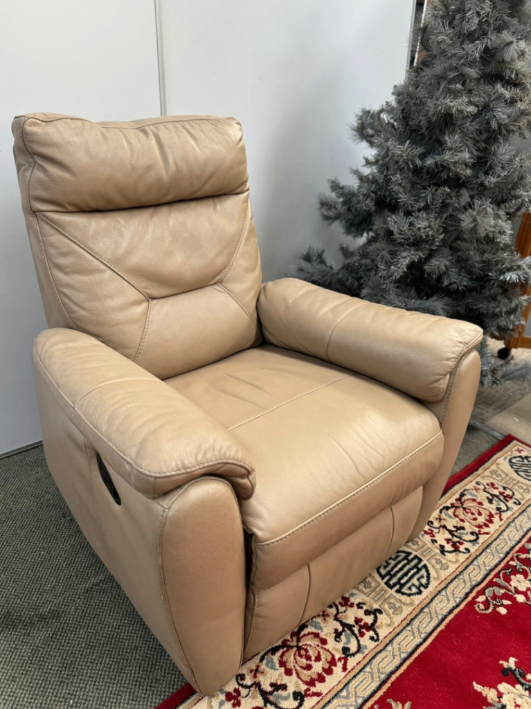 This is a Next Oslo Recliner Chair in a latte or beige color leather. 