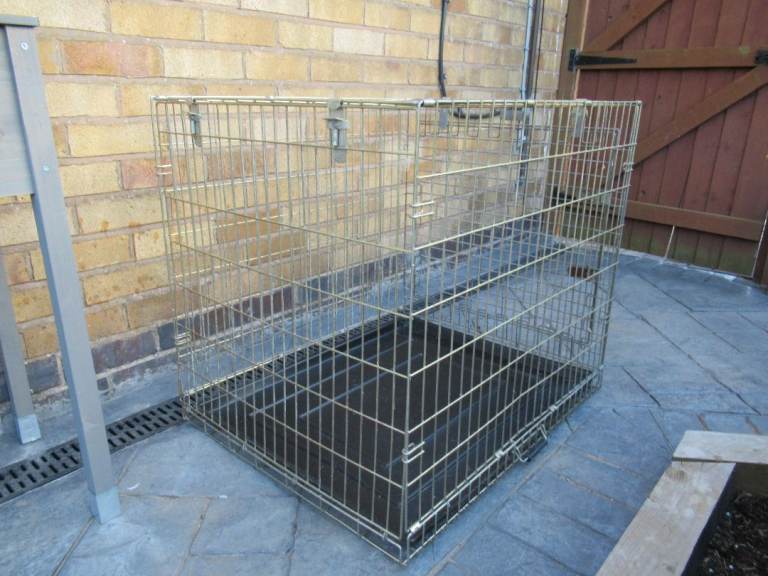 Medium/large dog crate height 70cm, width 64cm, length 79cm.