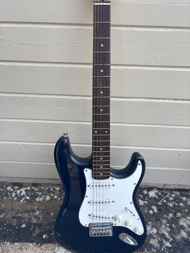 Black Electric Guitar - Good Condition, Ready to Play