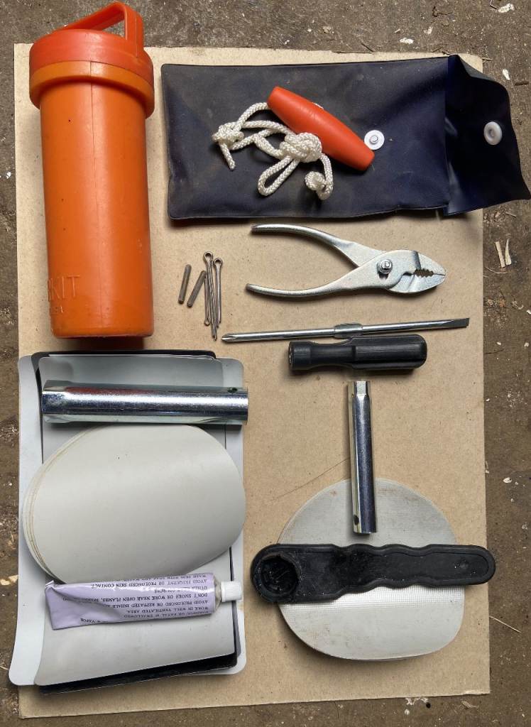 Inflatable dinghy & outboard engine repair kit.
