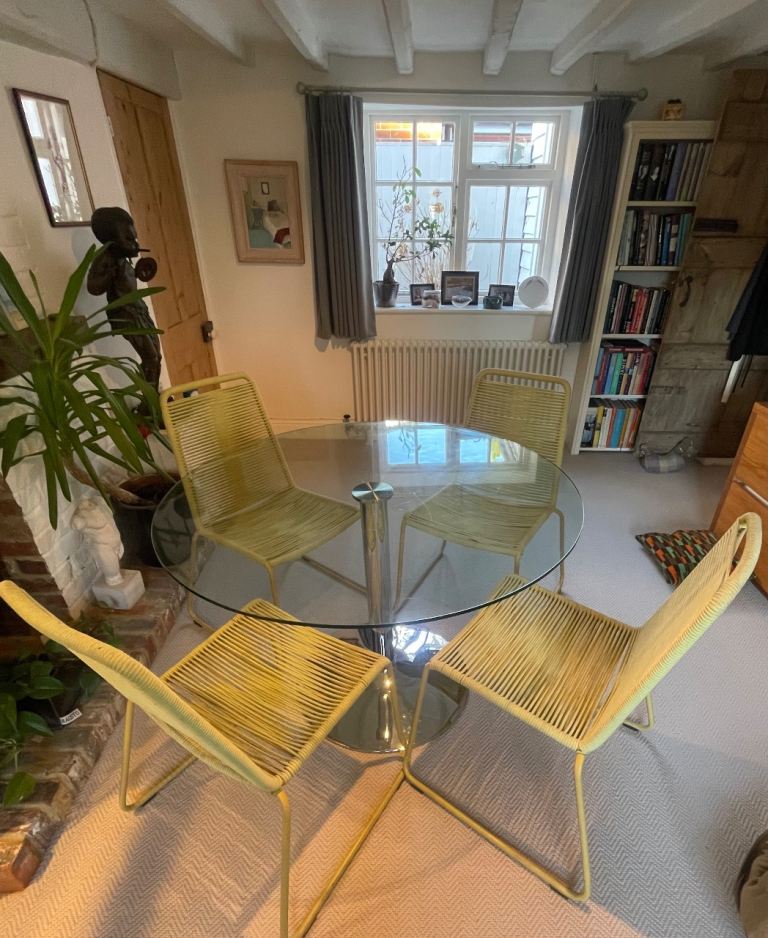 Circular Glass top dining table with chrome base