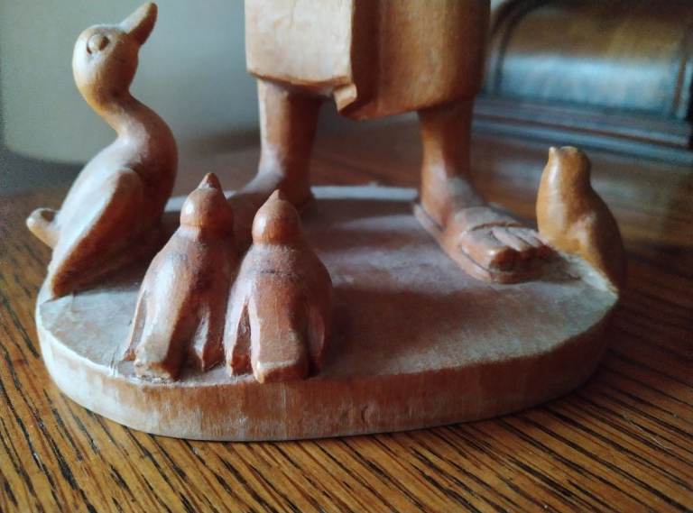 Wooden Seated angel and singing monk