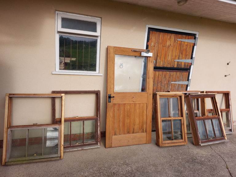 6 Timber sliding sash windows and matching door