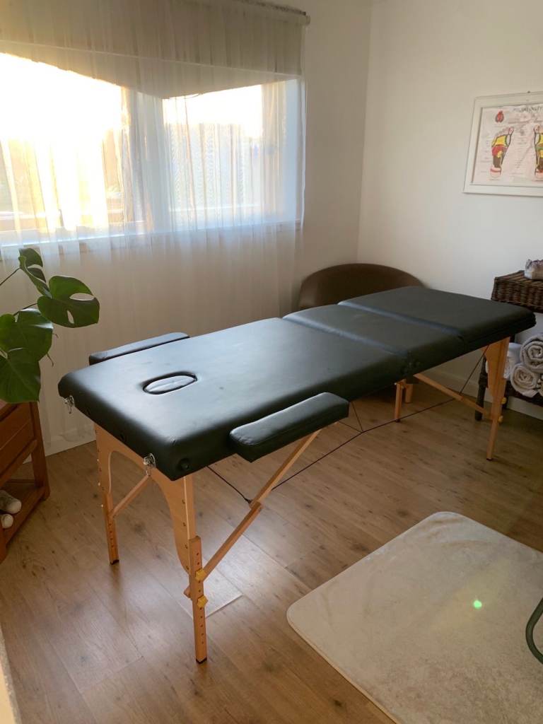 Solid and portable massage table for sale.