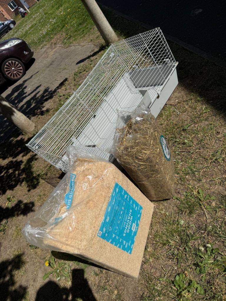 Rabbit cage with bedding and Hay