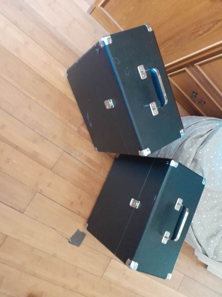 Two Black Storage Trunks with Chrome Hardware – Good Condition