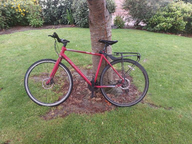 Bike: 3x8 speed, mechanical disc brakes, puncture proof tires, tired but rideable