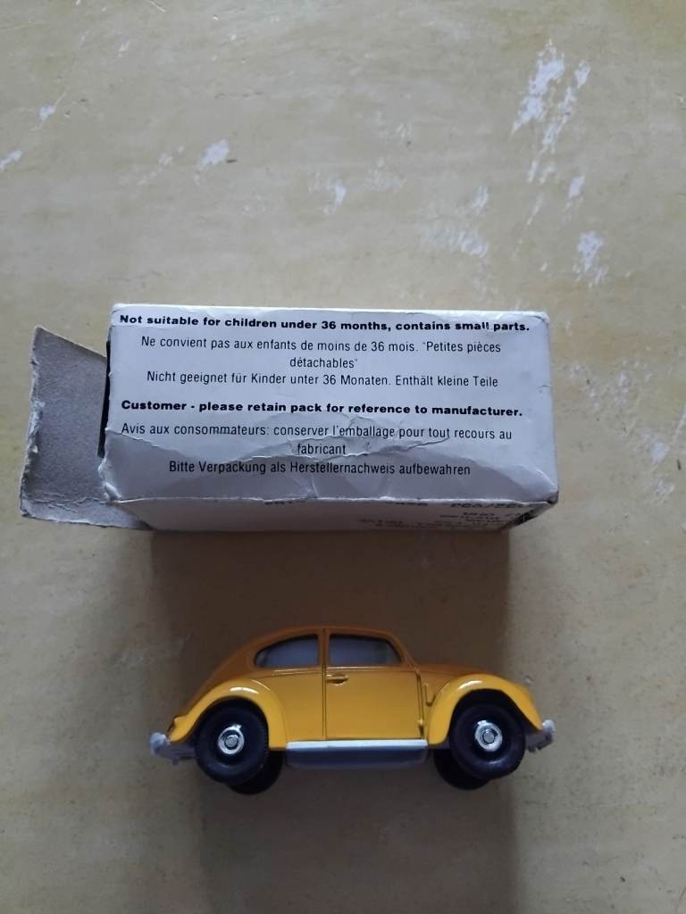 Corgi VW Beetle in yellow.