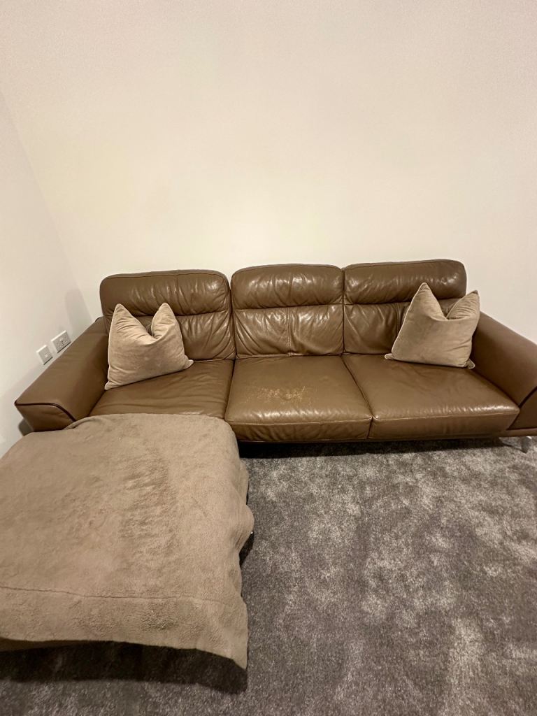 Brown leather L-shaped three-seater sofa from DFS