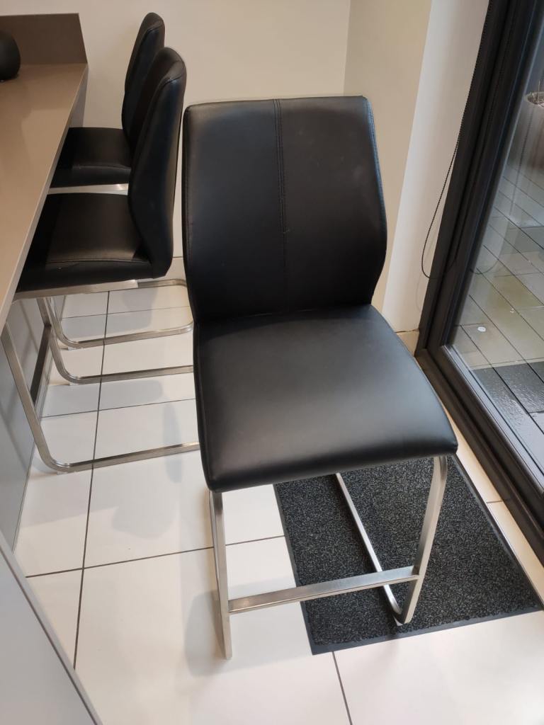 Black faux leather barstools 