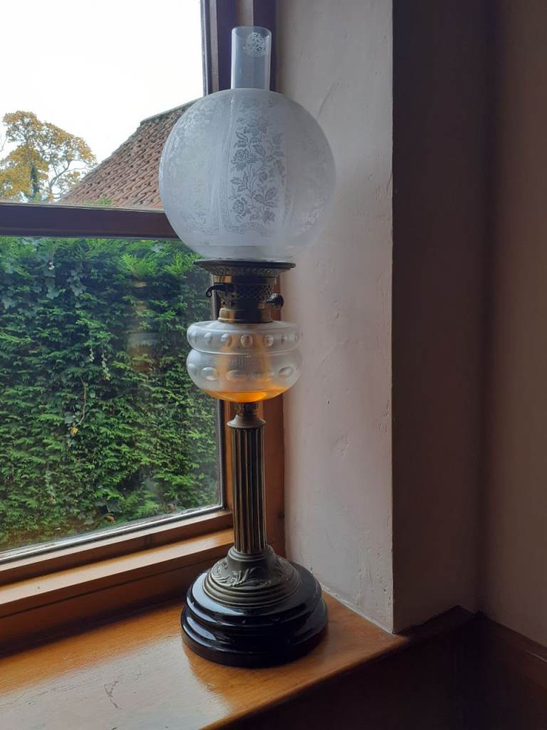 Victorian oil lamp with glass globe