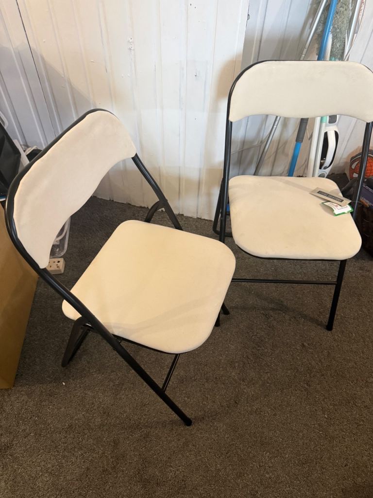 6 new never used foldable chairs cream velvet  texture and black metalwork