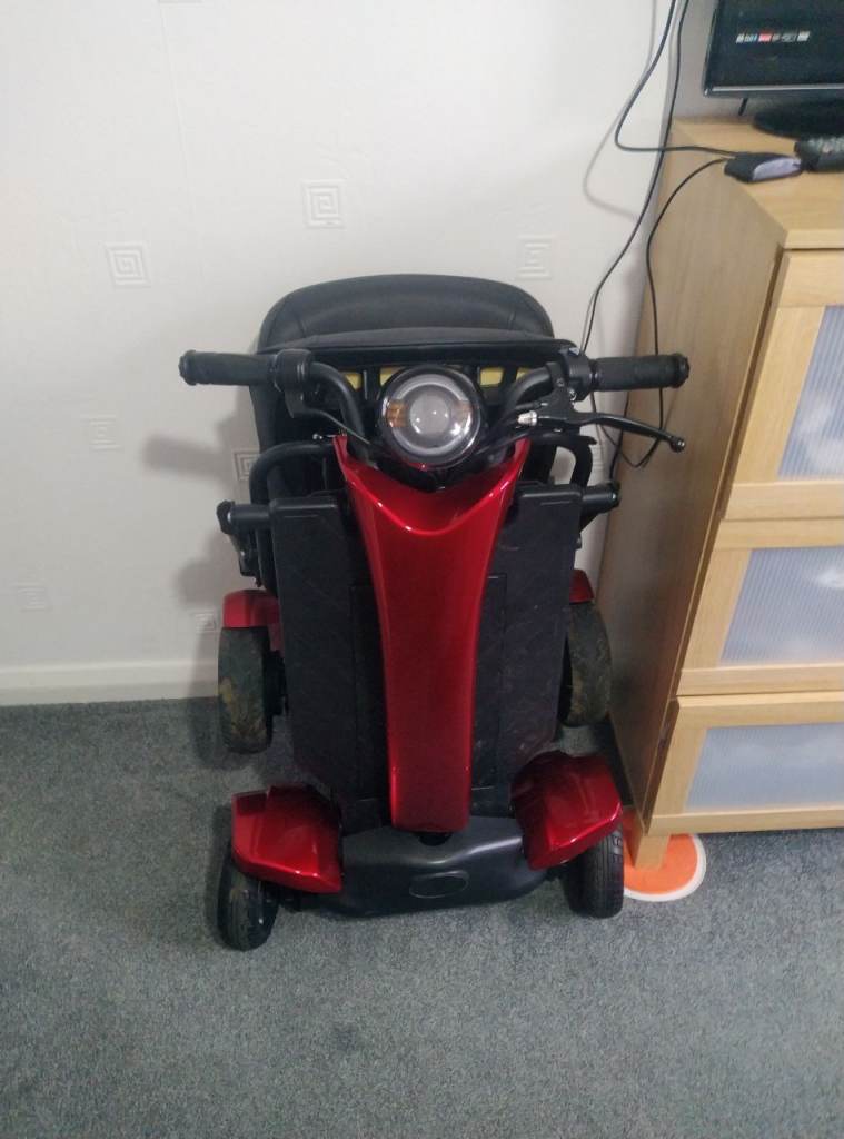 Remote folding electric mobility scooter