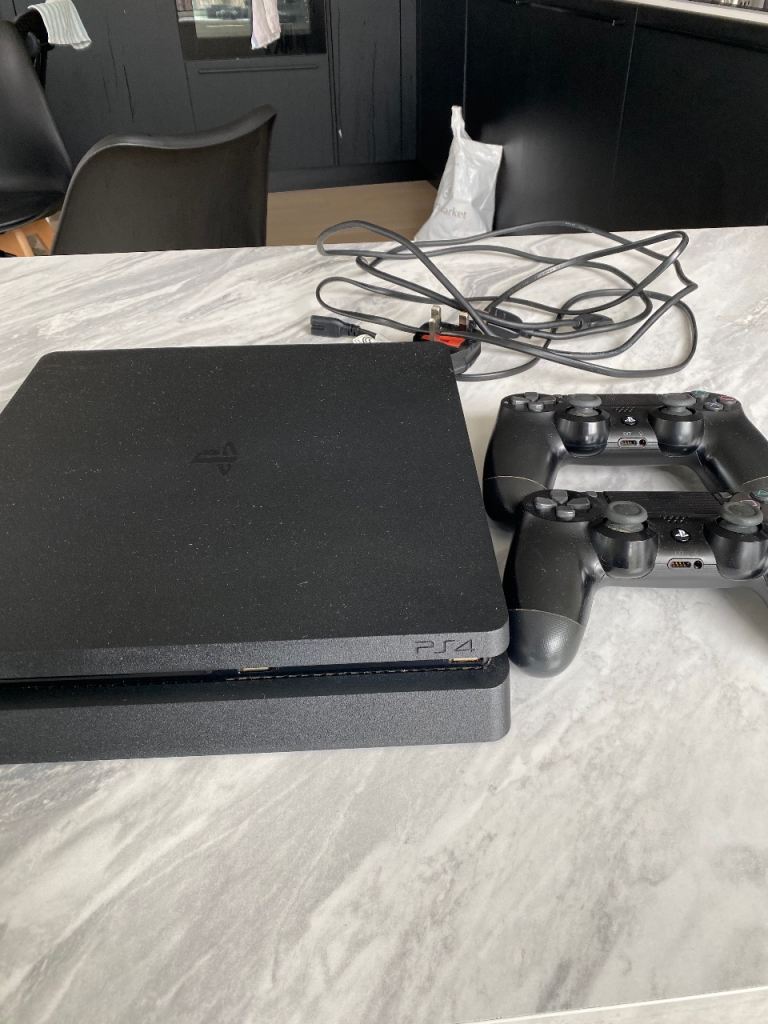 Clean Sony PlayStation 4 Slim with 2 Controllers and Cables – Good Condition
